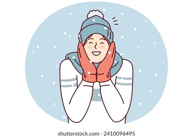 Happy man in sweater and mittens smiling enjoy cold weather and rejoice december holidays. Positive young guy in winter hat and scarf stands outdoors among falling snowflakes. Flat vector design
