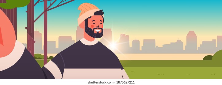 happy man taking selfie on smartphone camera guy making self photo in urban park cityscape background horizontal portrait vector illustration