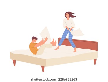 Happy man and woman fighting pillows on bed, playful family couple having fun together at home