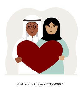 Happy man and woman holding a big red heart in their hands. Love