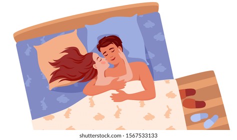 happy man and woman lie in bed and hug, kiss