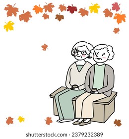 Happy mature women sitting at park, drinking tea and looking at falling leaves. Senior woman and friend watching fall foliage. Autumn is coming theme with two women resting and watching falling leaves