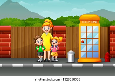 Happy mother and children standing on the roadside