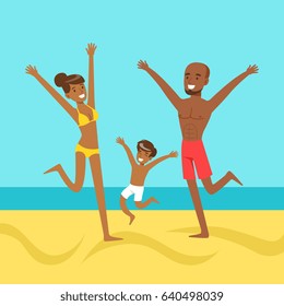 Happy mother and father with their son jumping together on a beach