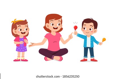 happy mother give candy and sweets to his boy and girl kid