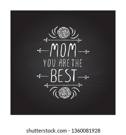 Happy mother s day handlettering element with flowers on chalkboard background. Mom you are the best. Suitable for print and web