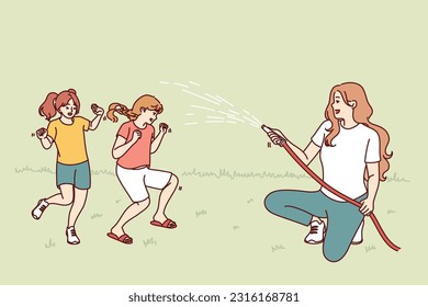 Happy mother watering laughing children with hose enjoying summer walk in park or backyard for perfect family concept. Family fun in summer weather and pouring cold water during drought