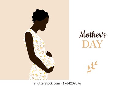 Happy mother's day. Afro American woman in beautiful floral pattern dress. Mother holds her belly. Lettering type.