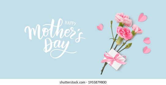 Happy Mothers day. Calligraphic greeting text. Holiday design template with realistic pink carnation flowers, gift box and hearts on blue background. Vector stock illustration.