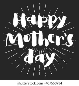 Happy mother's day chalk greeting card. Brush white letters with rays on dark background.