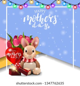 Happy mother's day, greeting blue card with beautiful lettering, garland, frame for text, plush rabbit, tulips and gift