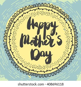 Happy Mothers Day Greeting Card. Black ink modern calligraphy on colorful blue and yellow background with cute circular ornament. Handwritten inscription.