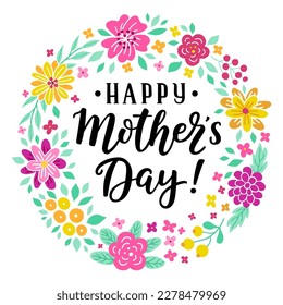 Happy Mother's day hand-drawn lettering phrase. International holiday celebration card with floral wreath. Pink, yellow flower garland. EPS 10 vector illustration isolated on white background.