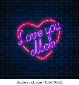 Happy Mothers Day neon glowing festive sign on a dark brick wall background. Love you mom in heart shape.