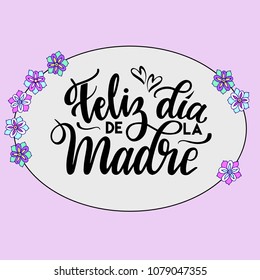 Happy Mother's Day text in Spanish 
 (Feliz Dia de la Madre). Festivity text in oval frame. Hand drawn lettering typography poster on pink background. Text card invitation, template. Vector.