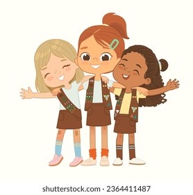 Happy multi ethnic multi aged Brownies girls scout hug. Girls Scout happily hug and smile. Girl together. Brownies Girls Scout