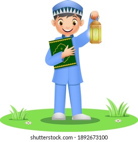 Happy muslim boy holding quran book with ramadan lantern