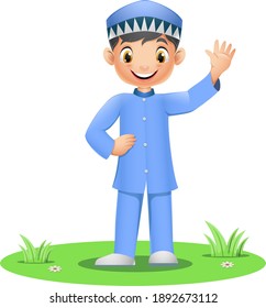 Happy Muslim boy standing on grass