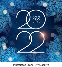 Happy new 2022 year! Elegant text with fir tree branches and light bokeh effect. Minimal text template