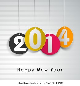 Happy New Year 2014 celebrations flyer, banner, poster or invitation with colorful hanging balls on shiny grey background. 