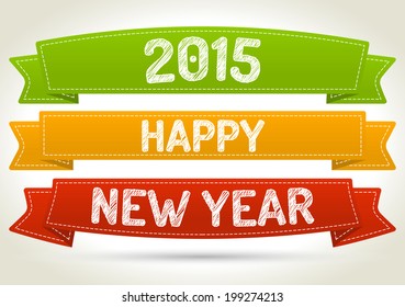 Happy new year 2015 on three different color ribbon with shadow on light background.