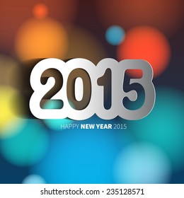 Happy New Year 2015 on blurred background with papercut year, vector illustration