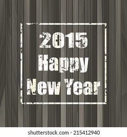 Happy new year 2015 stamp on the wooden background. 