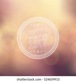 Happy new year 2017 in circle with bokeh and lens flare on yellow color blurred background (vector)
