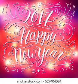 Happy new year 2017 hand lettering on blured background. Can be used for website background, calendar, printing, banner, greeting card. Vector illustration