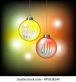 Happy New Year 2017 text on the hanged chrismas ball with background bokeh 
