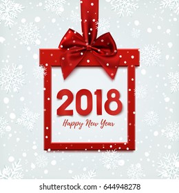 Happy New Year 2018 design, square banner in form of Christmas gift with red ribbon and bow, on winter background with snow. Greeting card, brochure or banner template. Vector illustration.