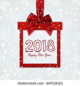 Happy New Year 2018 design, square banner in form of Christmas gift with red ribbon and bow, on winter background with snow. Greeting card, brochure, poster or banner template. Vector illustration.