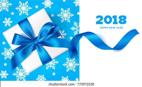 Happy New Year 2018.Decorative New Year background with gift box, blue bow, snowflakes and 
2018 greeting text. Winter holiday template design