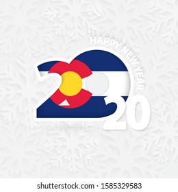 Happy New Year 2020 with flag of US state Colorado on snowflake background. Greeting Colorado with new 2020 year.