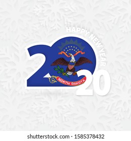Happy New Year 2020 with flag of US state North Dakota on snowflake background. Greeting North Dakota with new 2020 year.