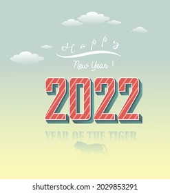 Happy new year 2022 background. Golden shiny numbers with confetti and ribbons on black background. Holiday greeting card design.