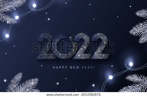 Happy New Year 2022 beautiful sparkling design\
of numbers on dark blue background with lights, pine branches and\
shining falling snow. Trendy modern winter banner, poster or\
greeting card template