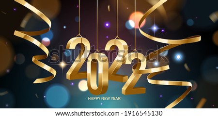 Happy New Year 2022. Hanging golden 3D numbers with ribbons and confetti on a defocused colorful, bokeh background.