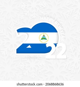 Happy New Year 2022 for Nicaragua on snowflake background. Greeting Nicaragua with new 2022 year.