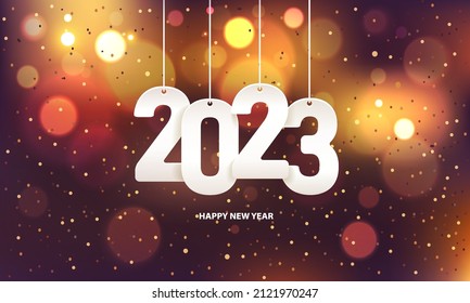 Happy new year 2023. Hanging white paper number with confetti on a colorful blurry background. - Shutterstock ID 2121970247