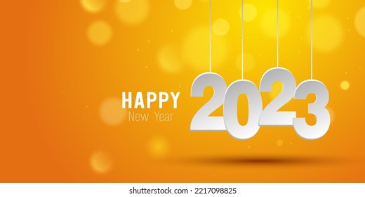 Happy New Year 2023  Hanging paper cut number   bokeh bubber orange gradient background 