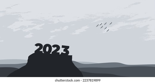 Happy New year 2023 with large silhouette letters on the mountain with a beautiful sunset for success concept. new year concept