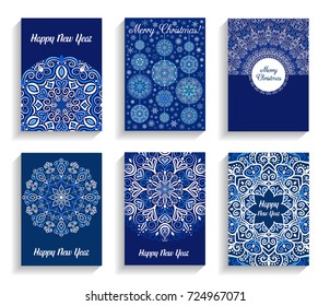 Happy New Year Cards. Vector text on flourish mandala backgrounds. Christmas Balls decoration. 5 to 7 ratio. Abstract flowers in blue and white. Intricate design elements for print.