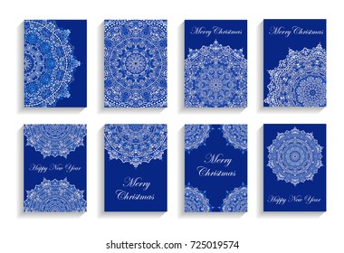 Happy New Year Cards. Vector text on flourish mandala backgrounds. 5 to 7 ratio. Abstract flowers in blue and white. Intricate design elements for print.
