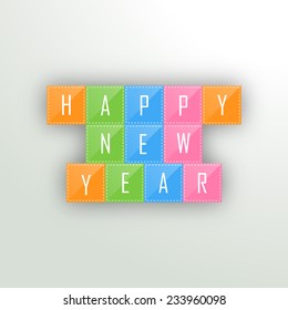 Happy New Year celebrations with wishing text on colorful blocks, can be used as poster, banner or flyer. 