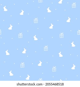 Happy new year and Christmas celebration seamless pattern with white rabbit silhouette,fir tree and gift boxes on blue background,tender print for wallpaper,cover design,packaging,holiday decor. 