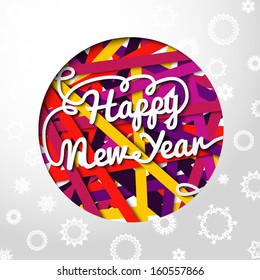 Happy New Year handwritten swirl lettering on greeting card made from bundle of bright laces on the paper with snowflakes, and cut through paper in shape of christmas ball. With place for your text. 
