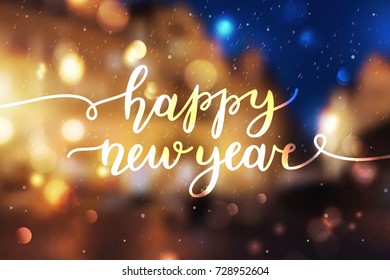 happy new year, lettering, greeting card of handwritten text on blurred background