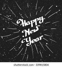 Happy New Year lettering with ink beam over black. Element for your Christmas designs and other your projects