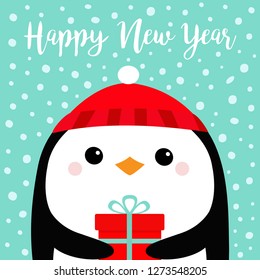Happy New Year. Penguin bird head face holding gift box. Red hat. Merry Christmas. Cute cartoon kawaii baby character. Funny animal. Flat design. Hello winter. Blue snow background Vector illustration